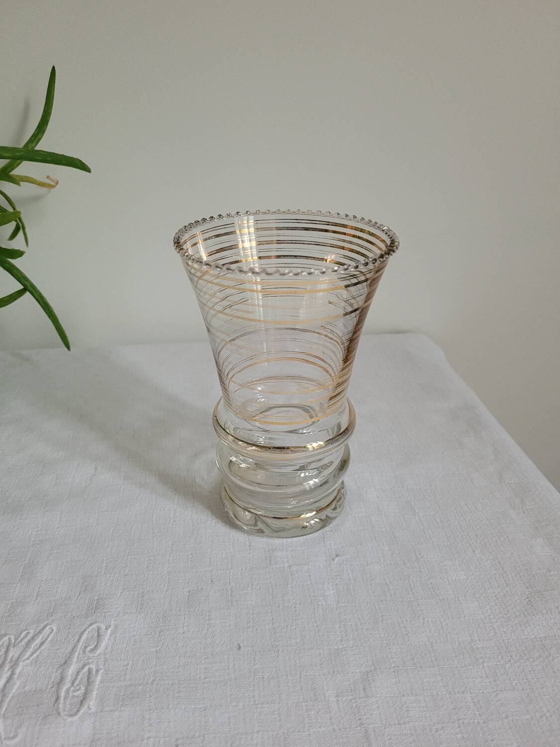 Flared glass vase with gold trim