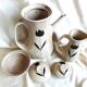 Vintage 23-piece Niderviller coffee set with hand-painted black tulip decor.