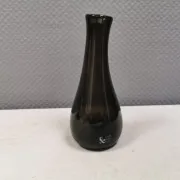 A unique vase in hand-blown glass with a hint of purple in the colour.