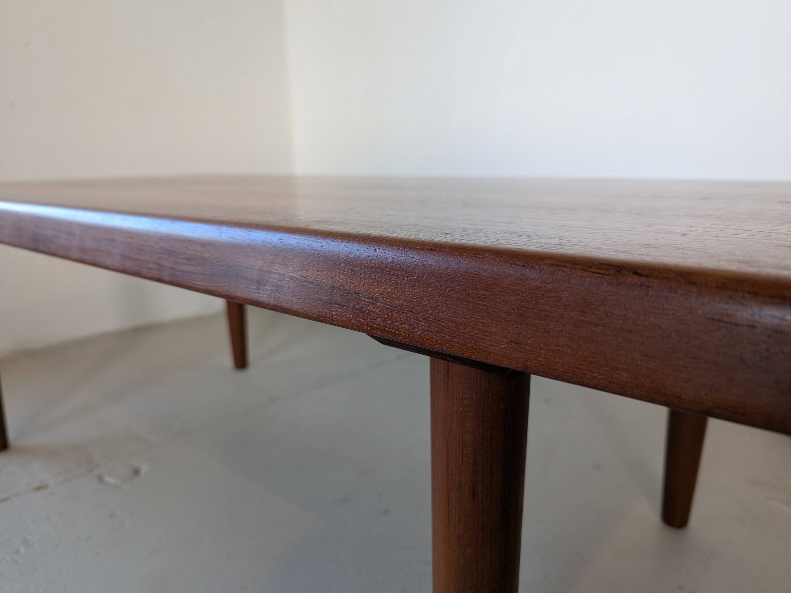Large solid teak table, design by Niels Bach, origin Denmark.