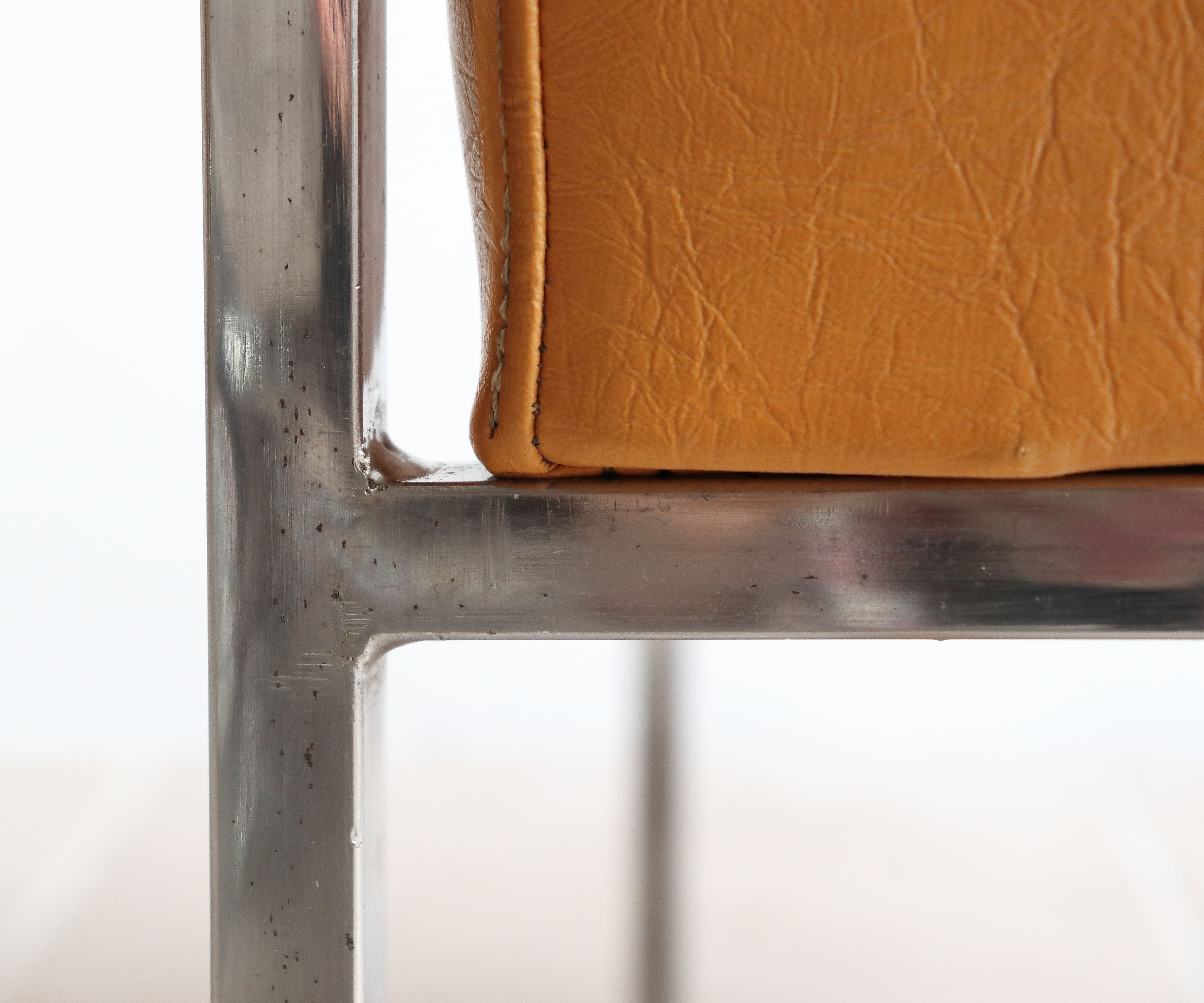 Modernist armchair in chromed metal and imitation leather, 50s/60s