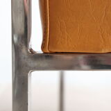 Modernist armchair in chromed metal and imitation leather, 50s/60s