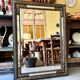 Rectangular Napoleon III mirror in moulded black and gold wood with engraved mirror decoration.