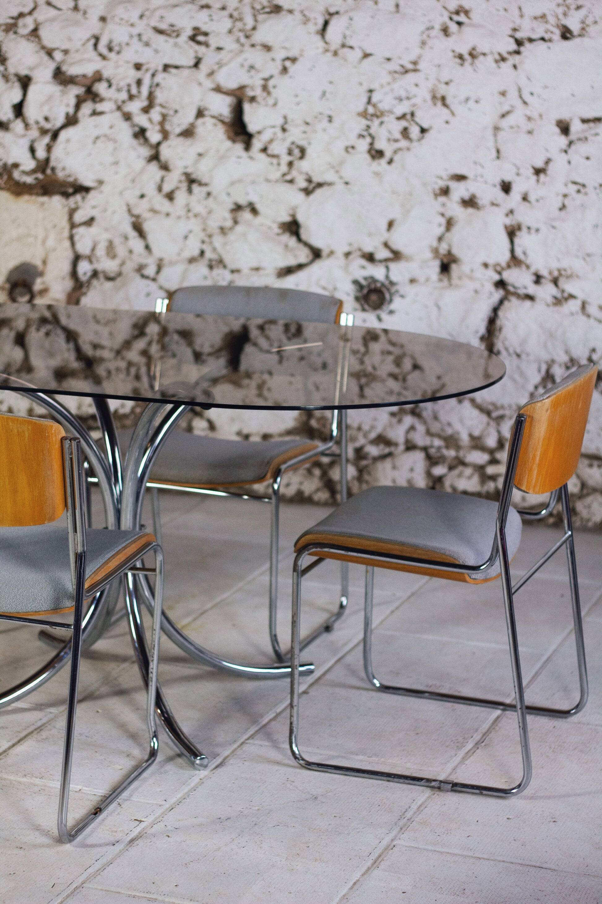 Oval dining table in chrome and smoked glass, 1970.