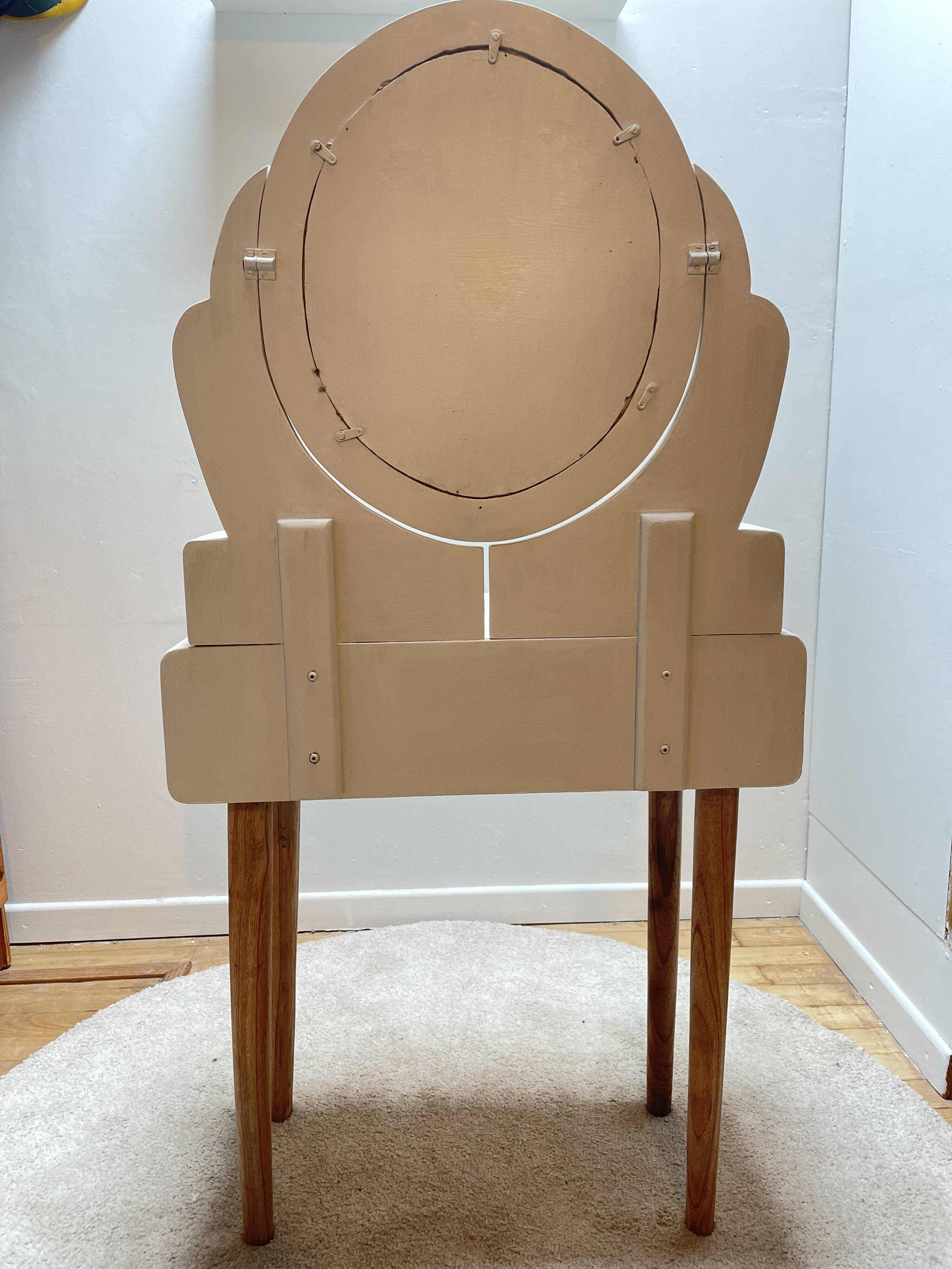 Wooden dressing table with beige and red baroque style mirror