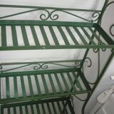 Folding green wrought iron shelf
