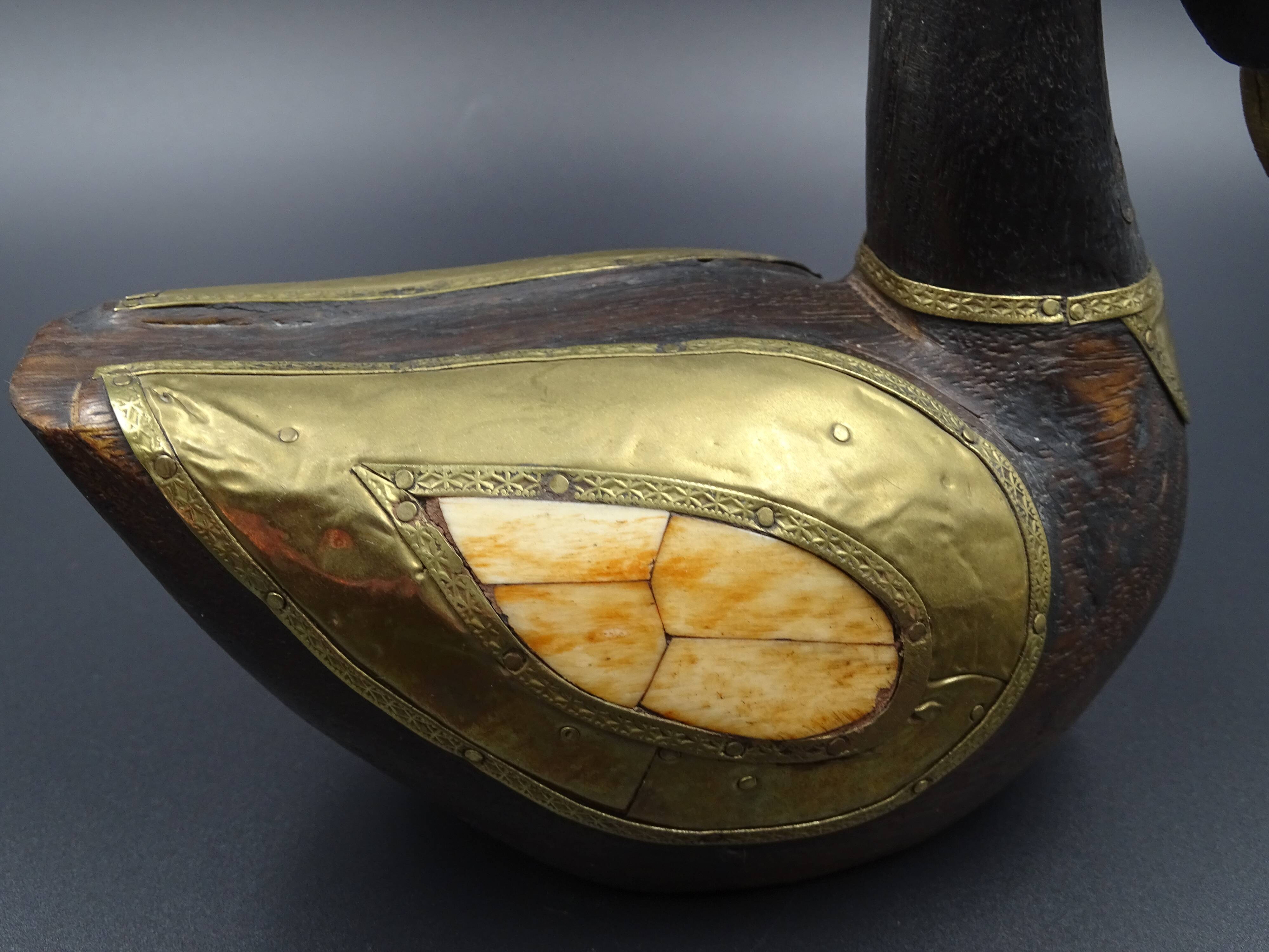 Wooden and brass swan