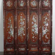 Asian screen in carved wood and mother-of-pearl marquetry.