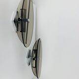 Pair of smoked glass and chrome wall lights from the 1970s.