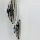 Pair of smoked glass and chrome wall lights from the 1970s.