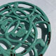 Enamelled cast iron trivet in blue with wrought iron decoration.