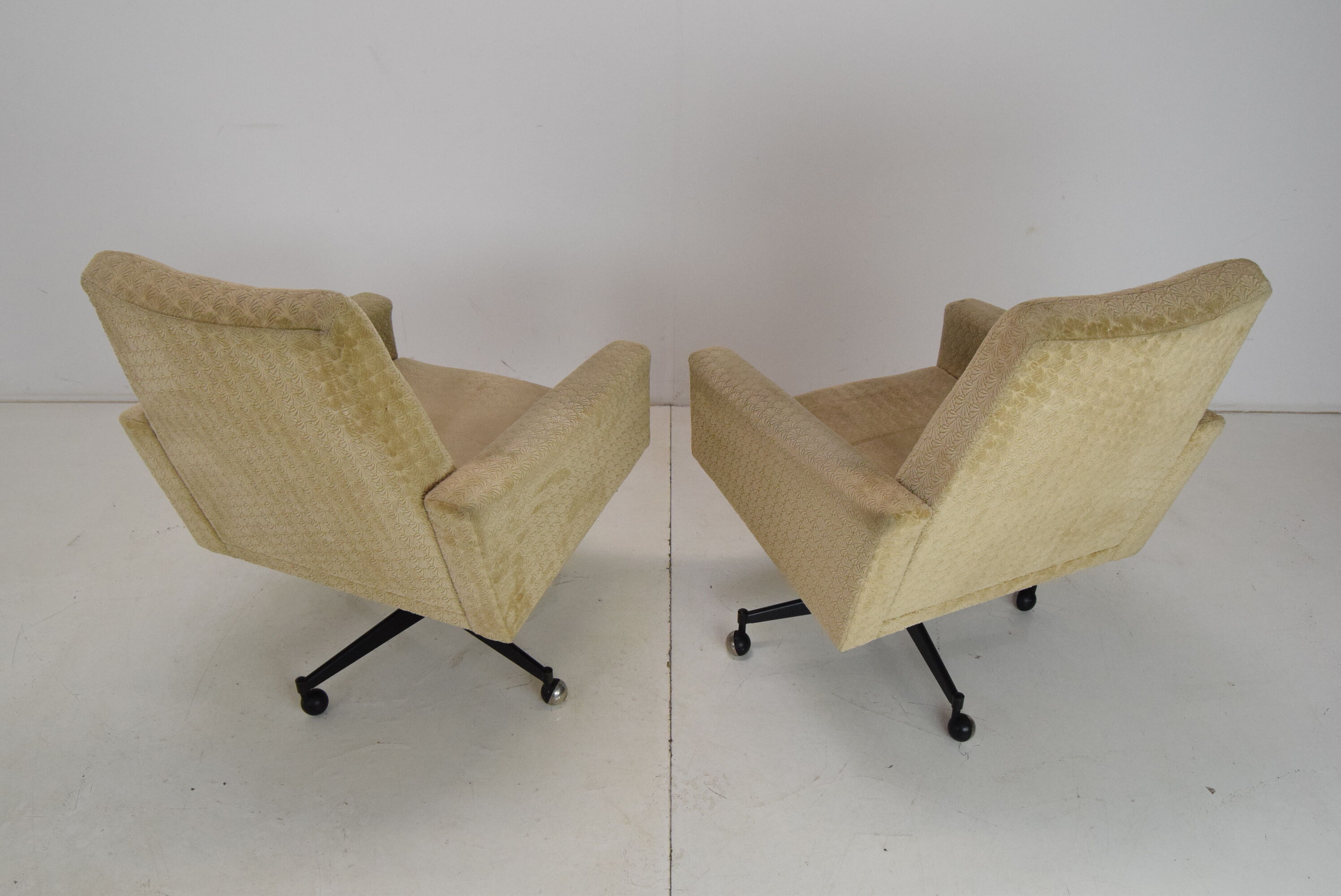Pair of mid-century swivel armchairs with wheels 1970's
