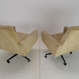 Pair of mid-century swivel armchairs with wheels 1970's