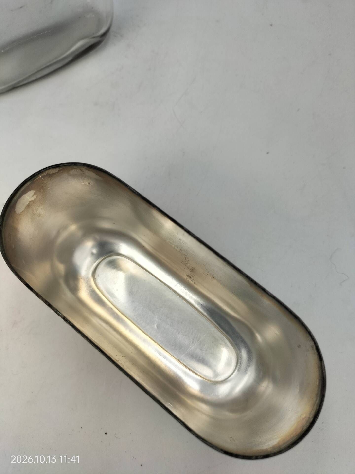 Silver-plated metal flask with leather and glass