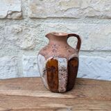 Old small pitcher in glazed terracotta