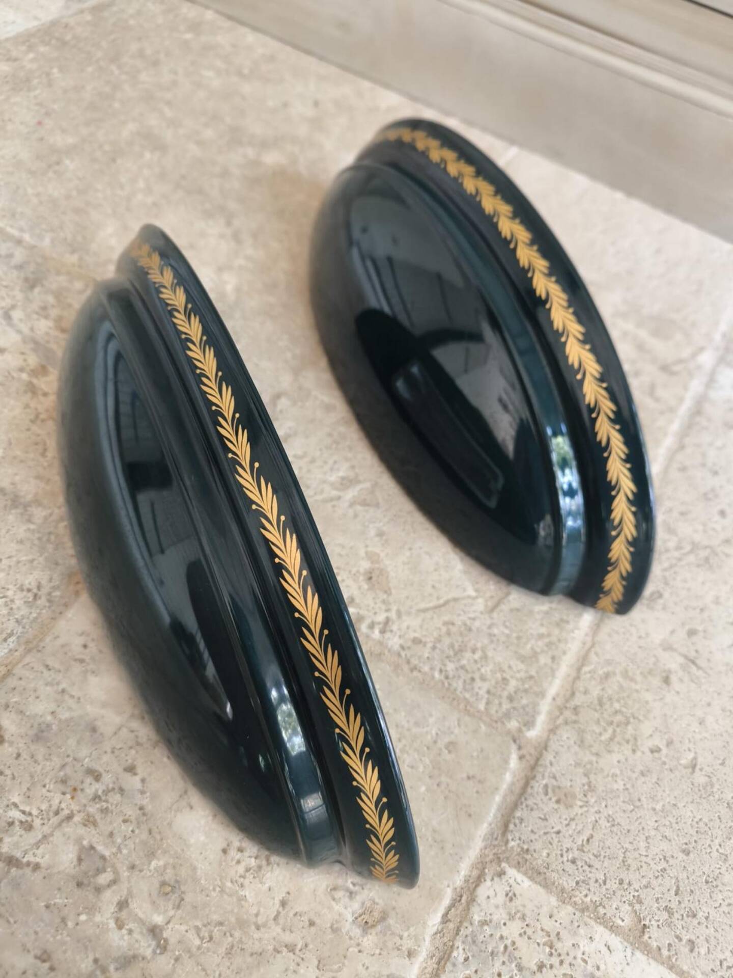 Set of two vintage wall sconces in pine green and gold.