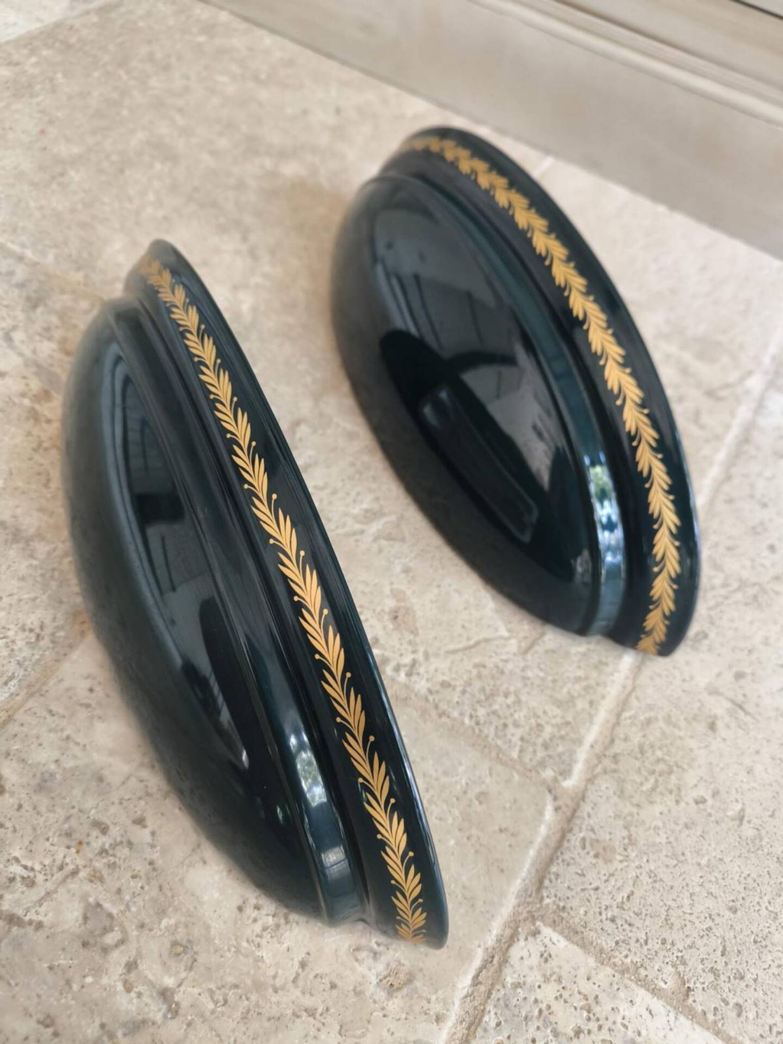 Set of two vintage wall sconces in pine green and gold.