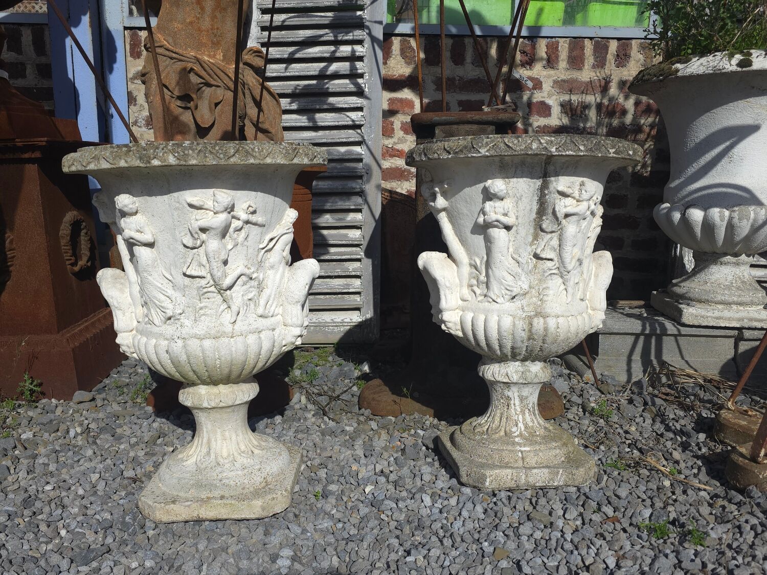 Medical vases with characters in reconstituted stone.