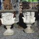 Medical vases with characters in reconstituted stone.