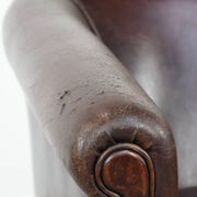 Stylish and sturdy dark brown club armchair made of sheepskin leather