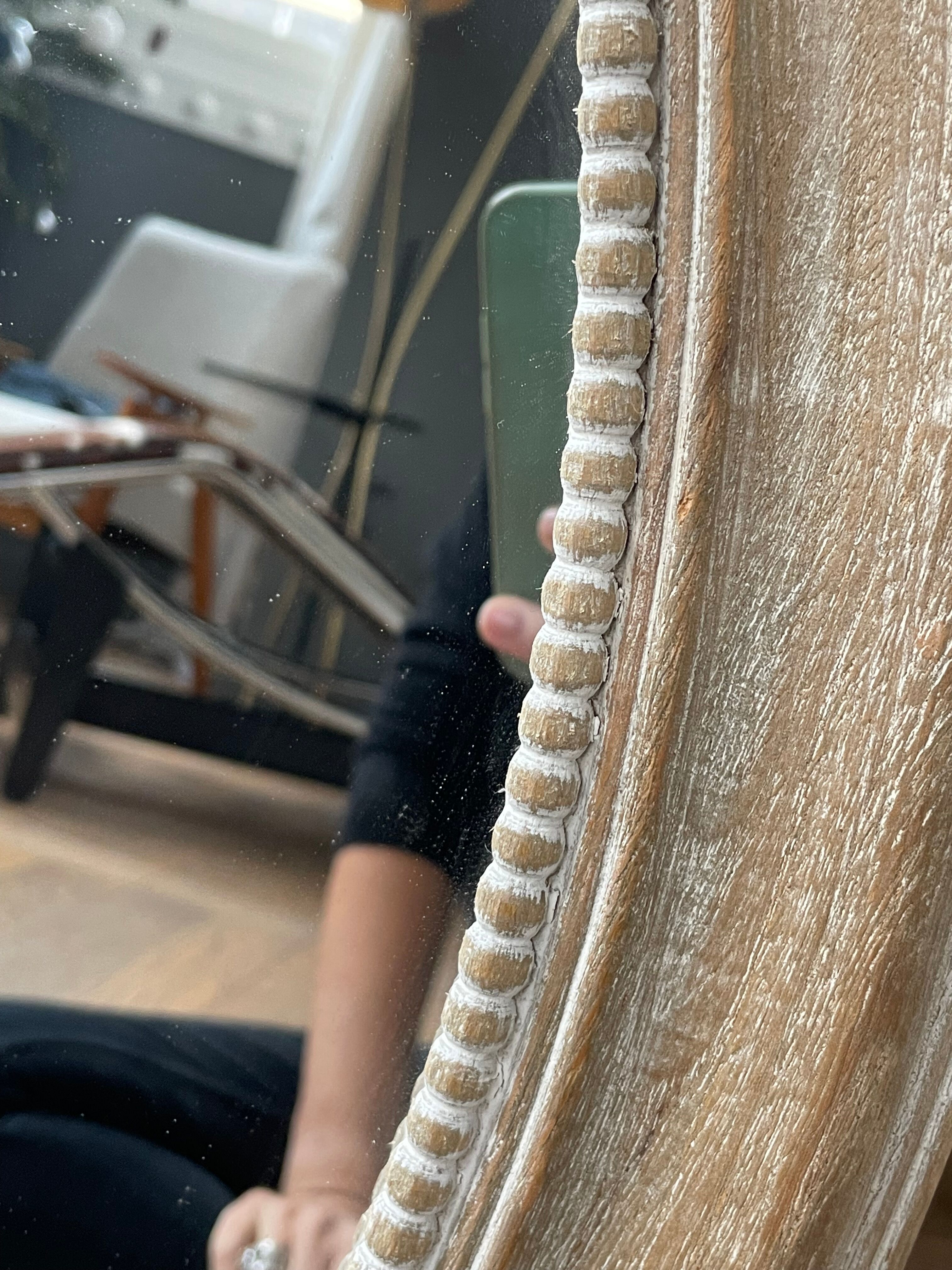 Oval-shaped wooden mirror