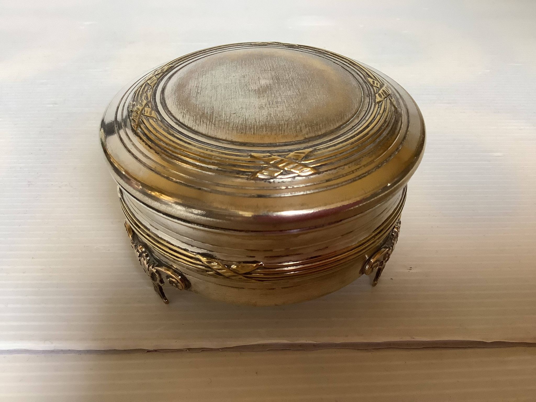 Antique silver-plated tripod box in the Louis XVI style.