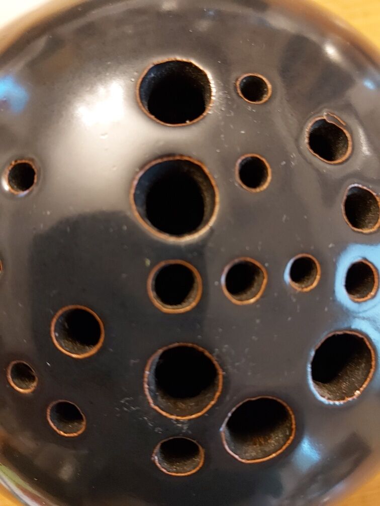 Signed ceramic flower-picker ball