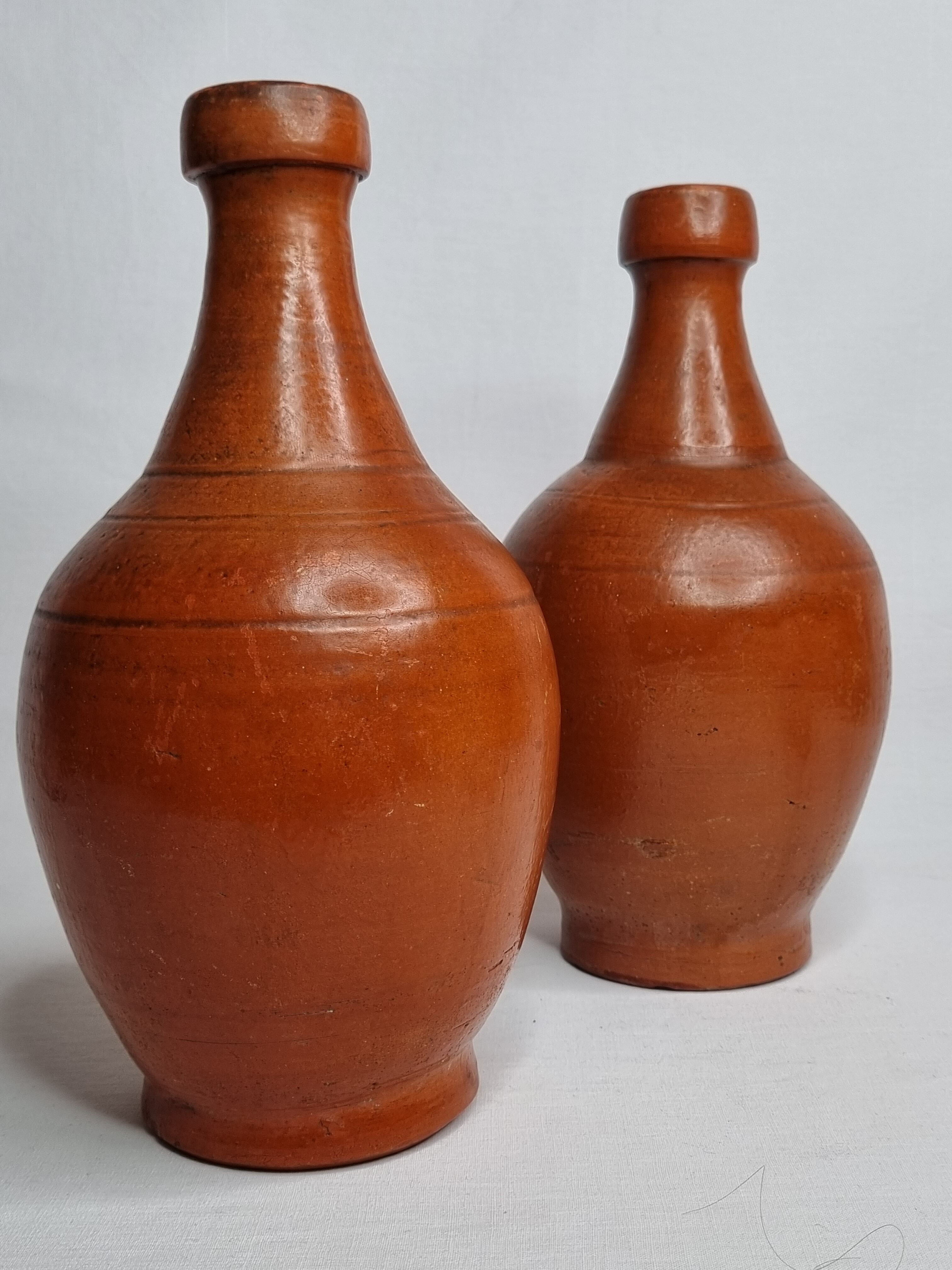 Pair of glazed terracotta jars, 26 cm