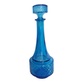 Turquoise glass carafe bottle with a stopper.