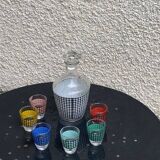 Liquor service consisting of a carafe and 6 small shot glasses, houndstooth pattern