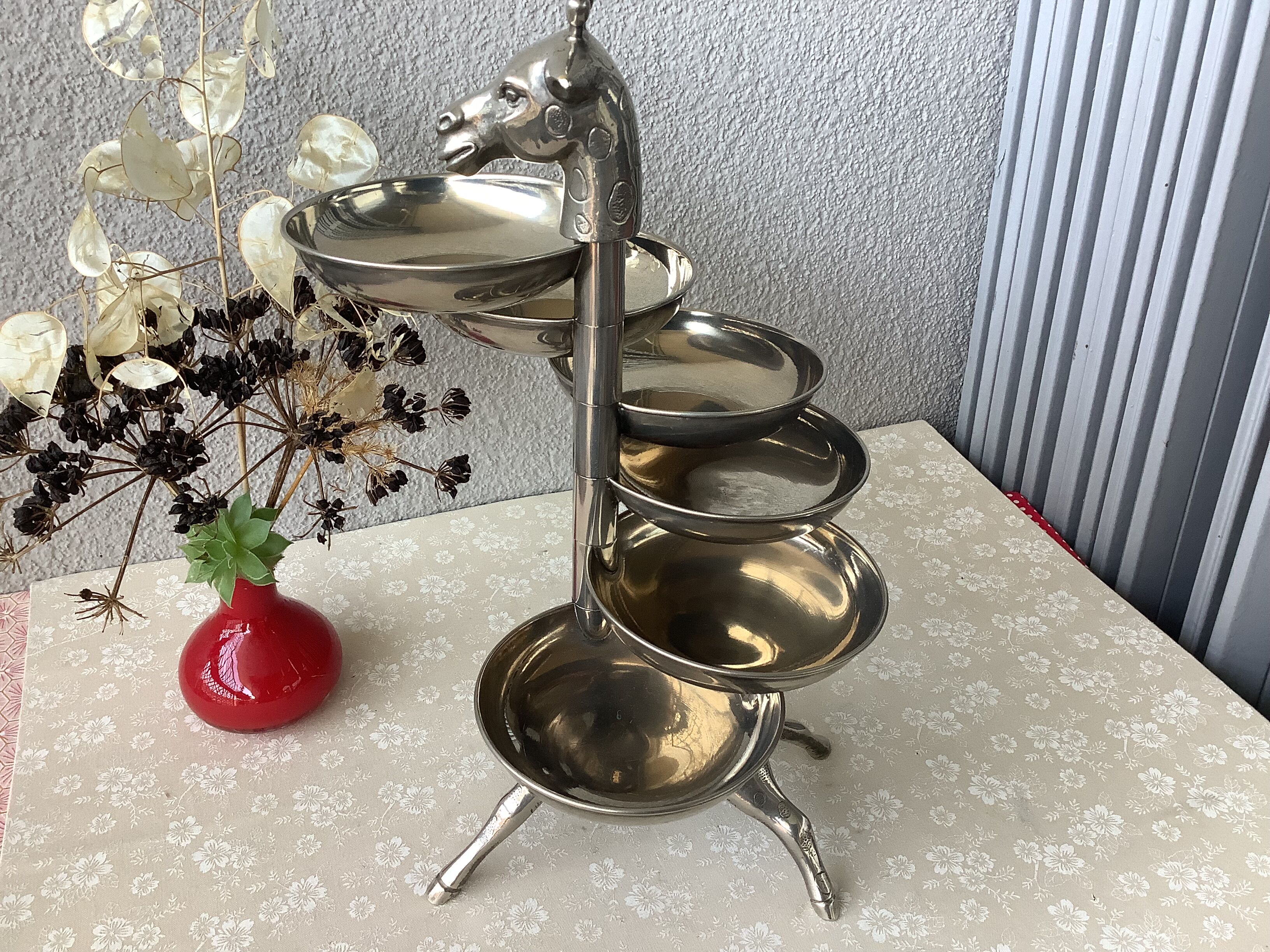 Bronze giraffe and silver metal servant