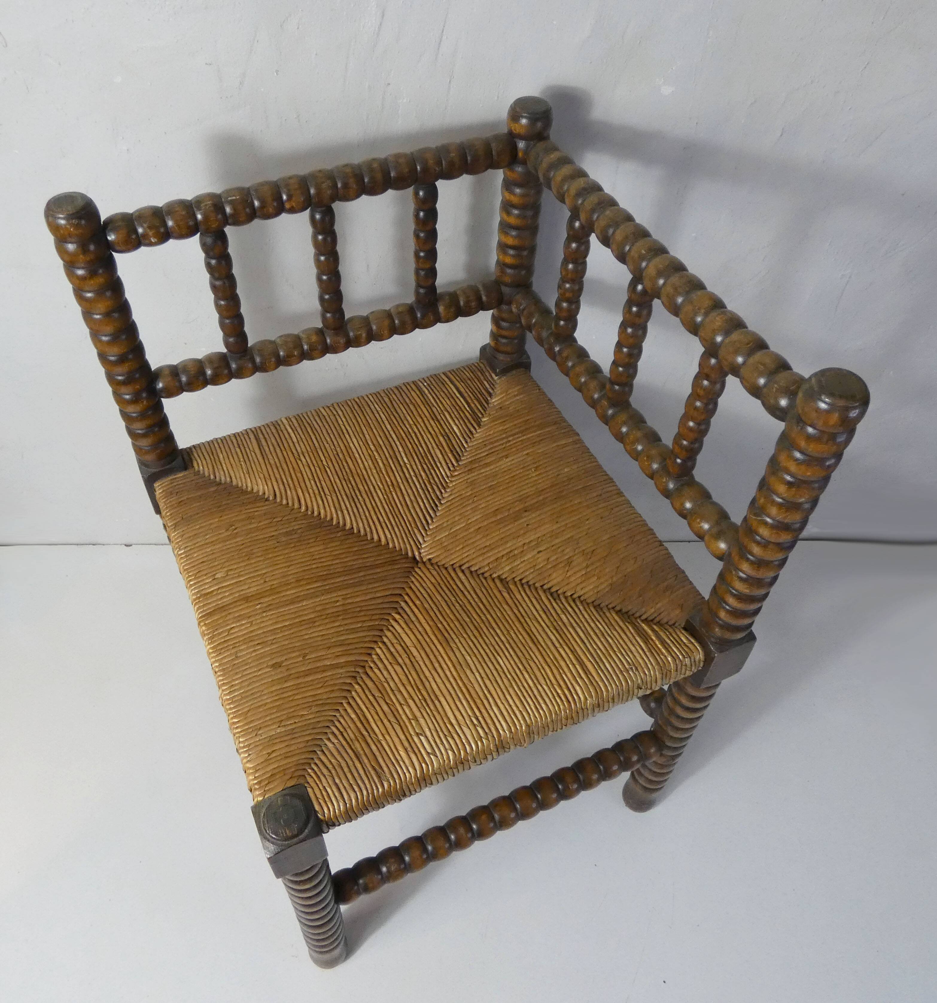 Old corner armchair beaded wood paillé