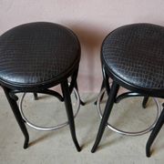 Pair of 1960s bistro bar stools in black and chrome with vinyl shell.