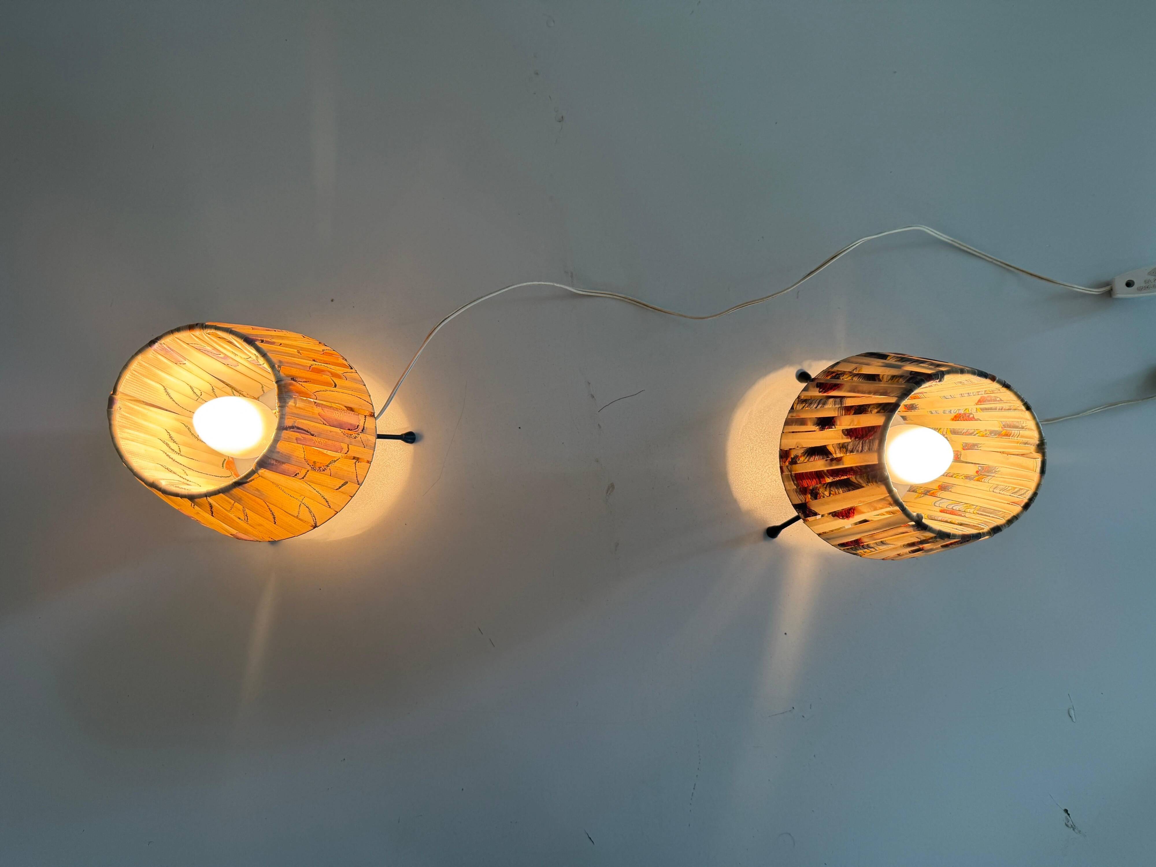 Pair of table lamps with plastic shades and tripod base, 1960s, Italy