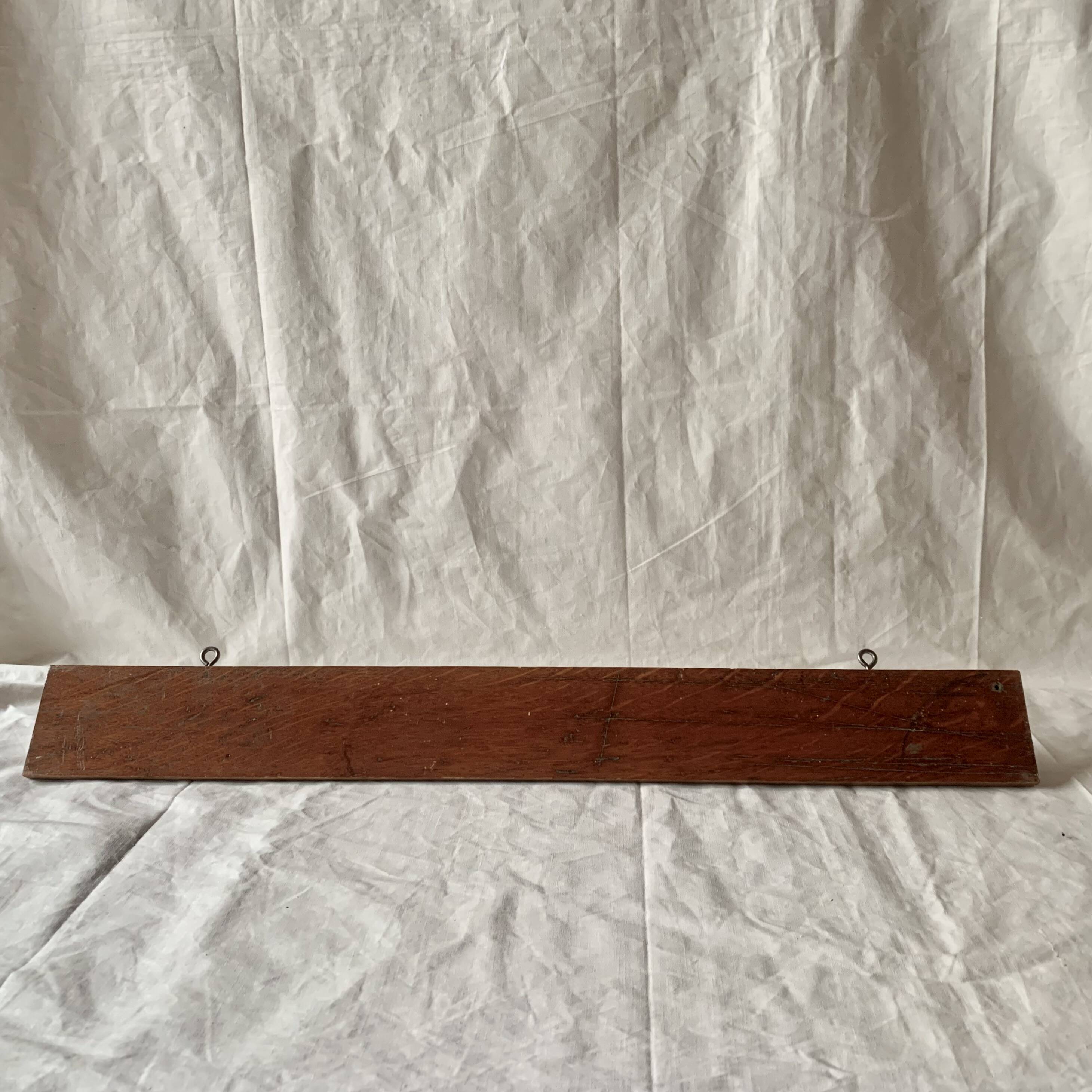 Vintage wooden wall-mounted coat rack with three double hooks