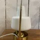 Table lamp in gold metal and opaline.