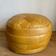 2 poufs moutarde patchwork en cuir de Sède