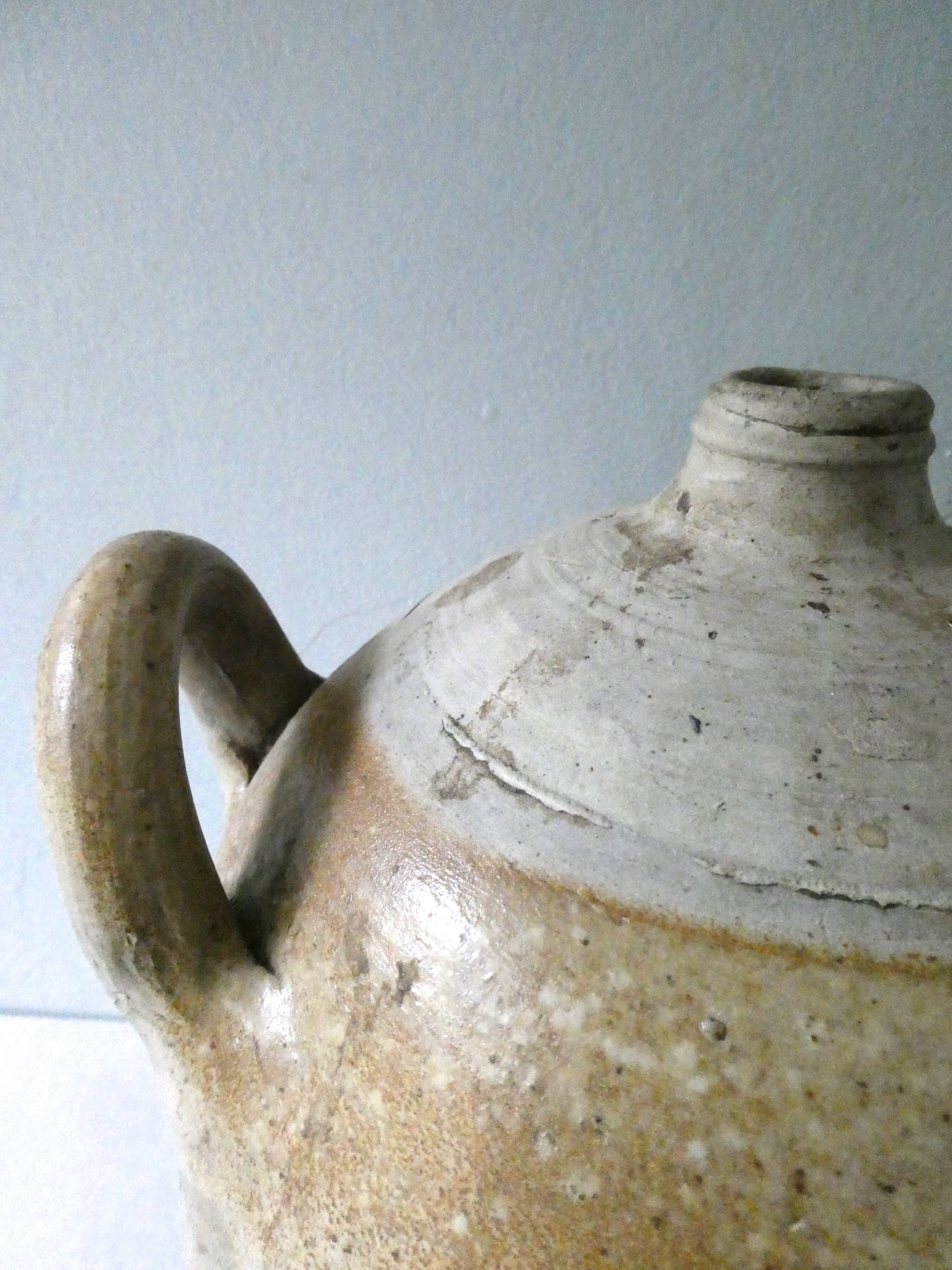 Old glazed stoneware bonbonne