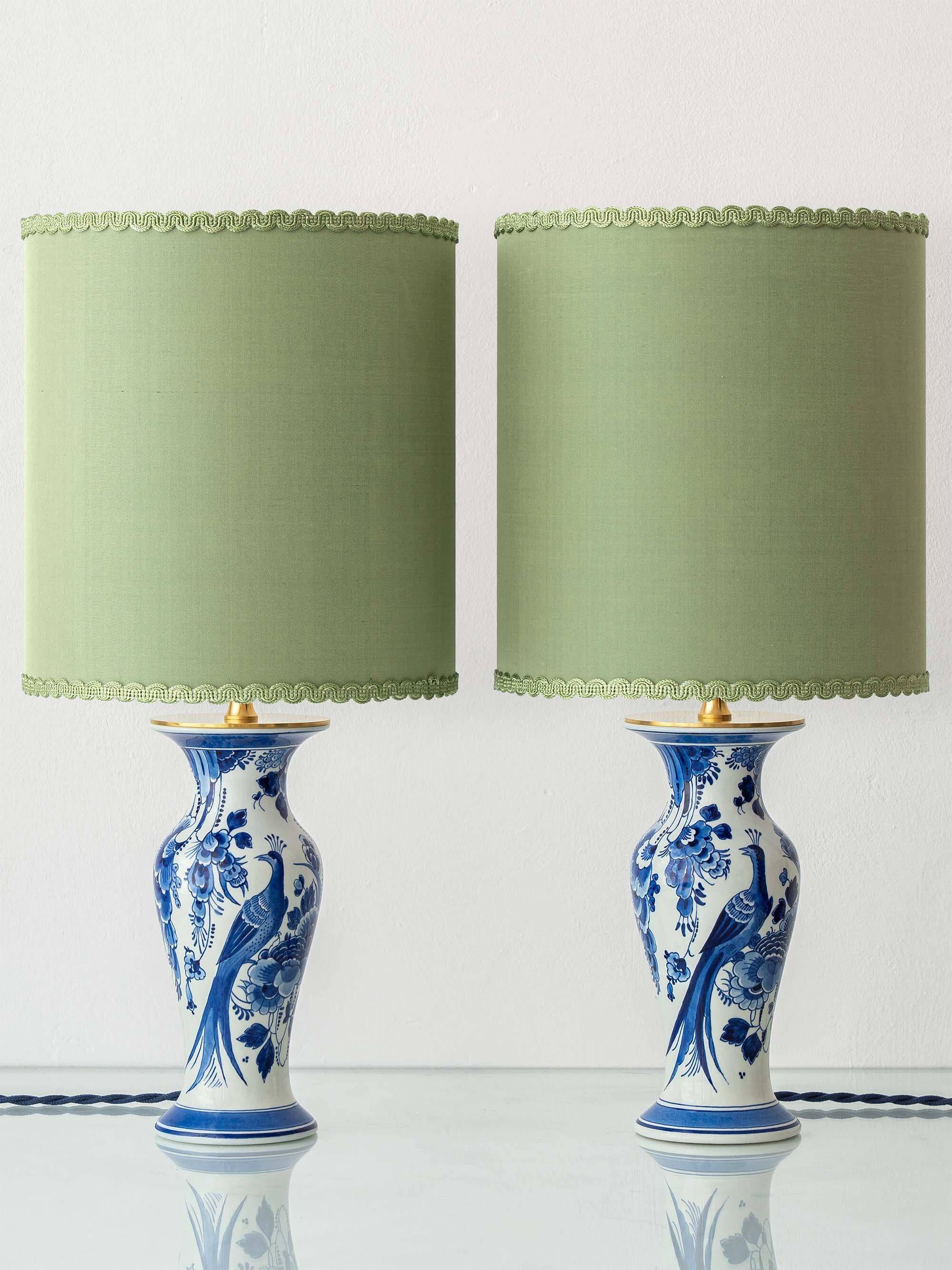 Pair of Chinese table lamps in Delft blue ceramic with new green silk shades.