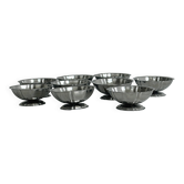 Set of 9 low bowls in shiny stainless steel.