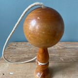 Old bilboquet in varnished wood