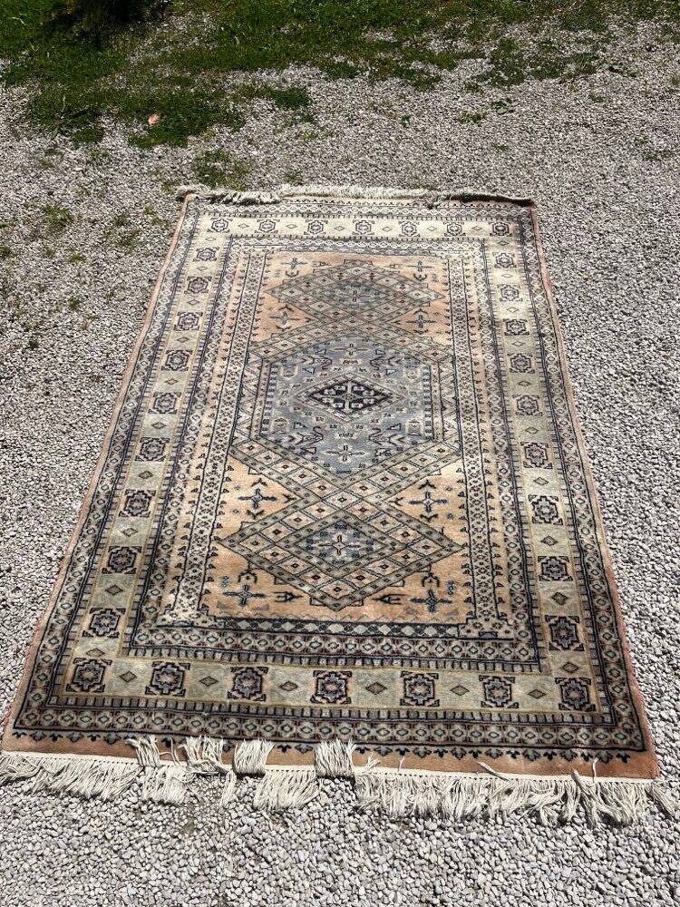 Antique Persian carpet made of wool.