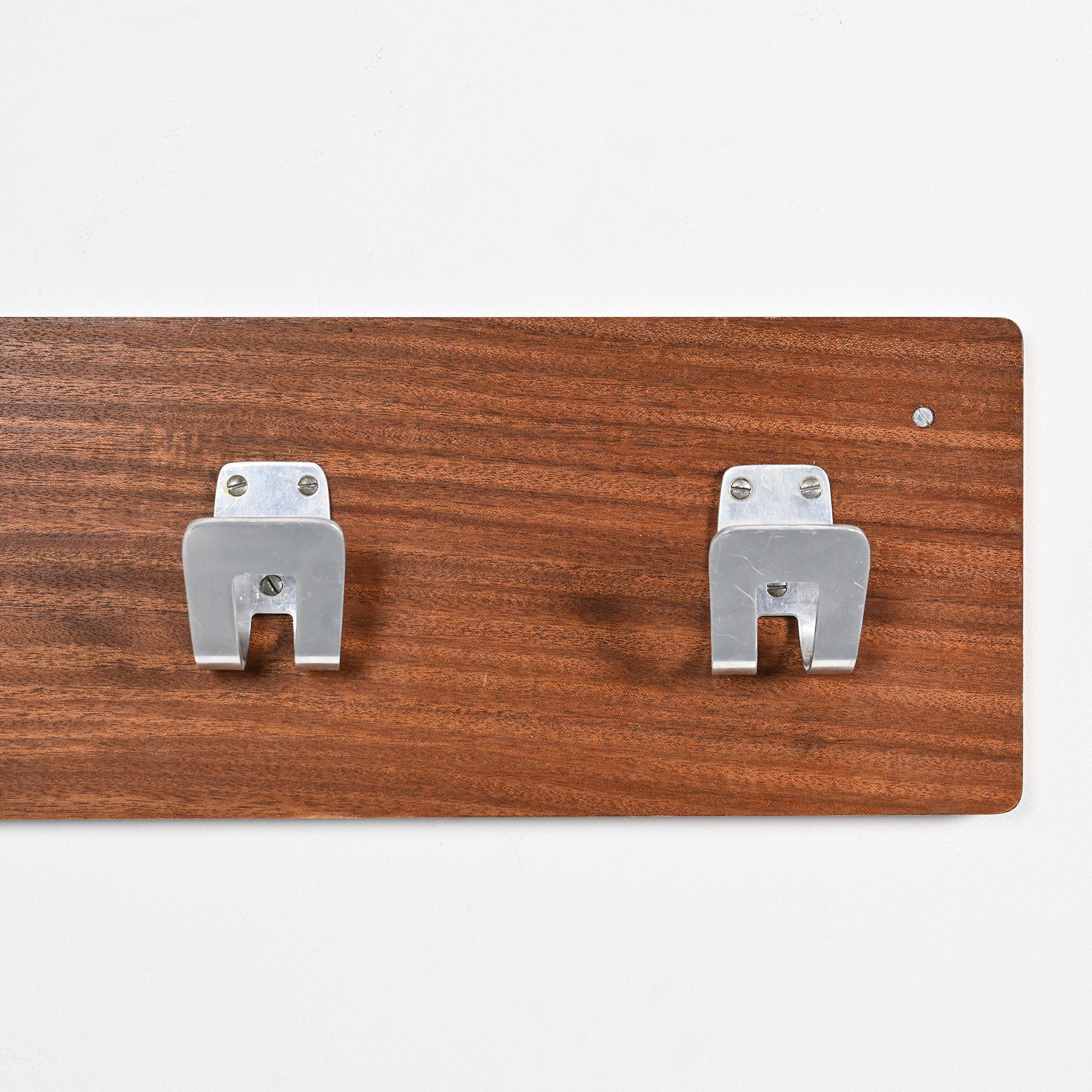 Wall coat rack and lights by Pierre Guariche for La Plagne, around 1968.