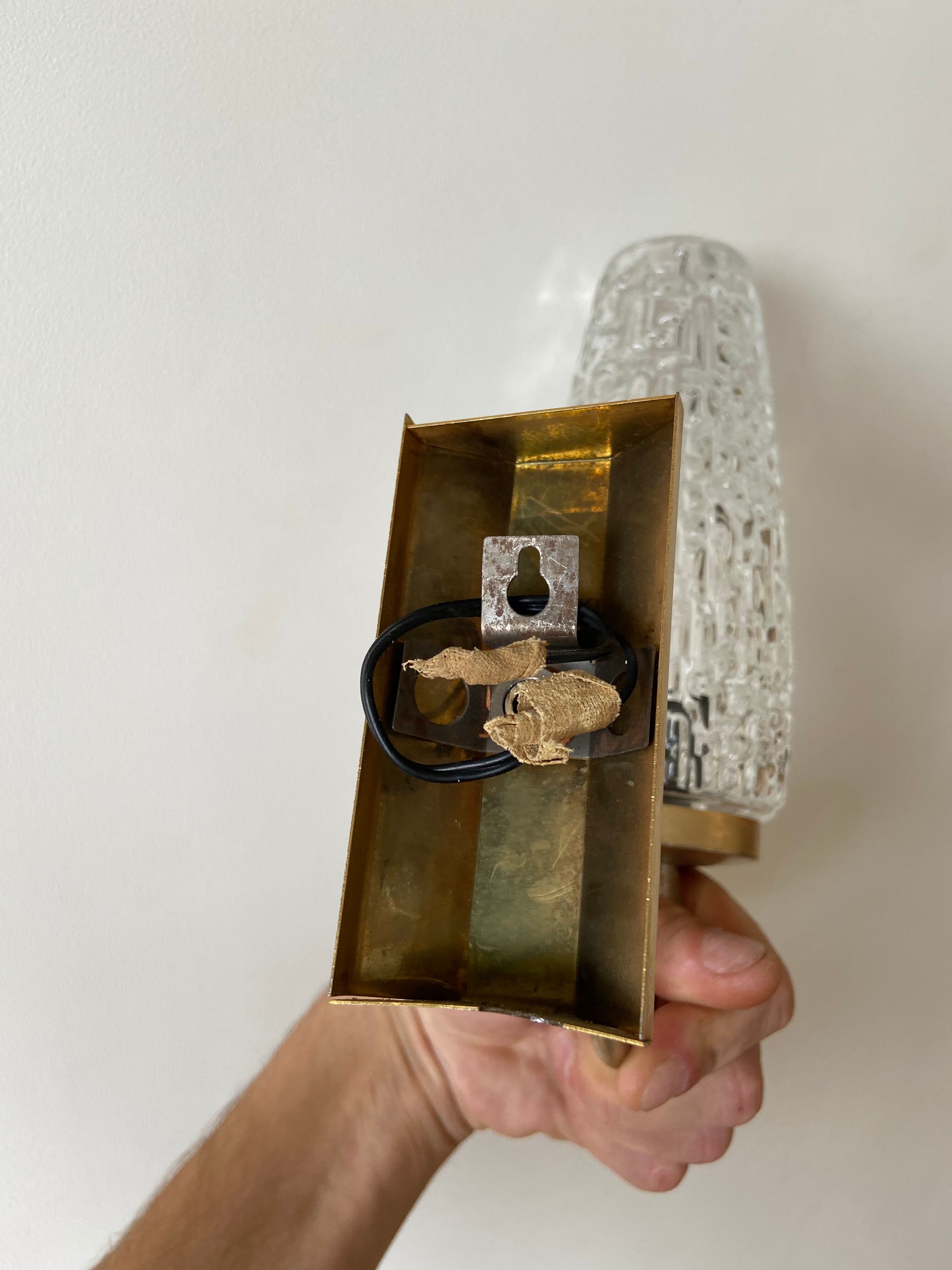 Gold metal and chiseled glass wall sconce