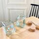 Pair of square jars in tinted glass and corks