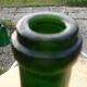 Green blown glass bottle of 58 cm.