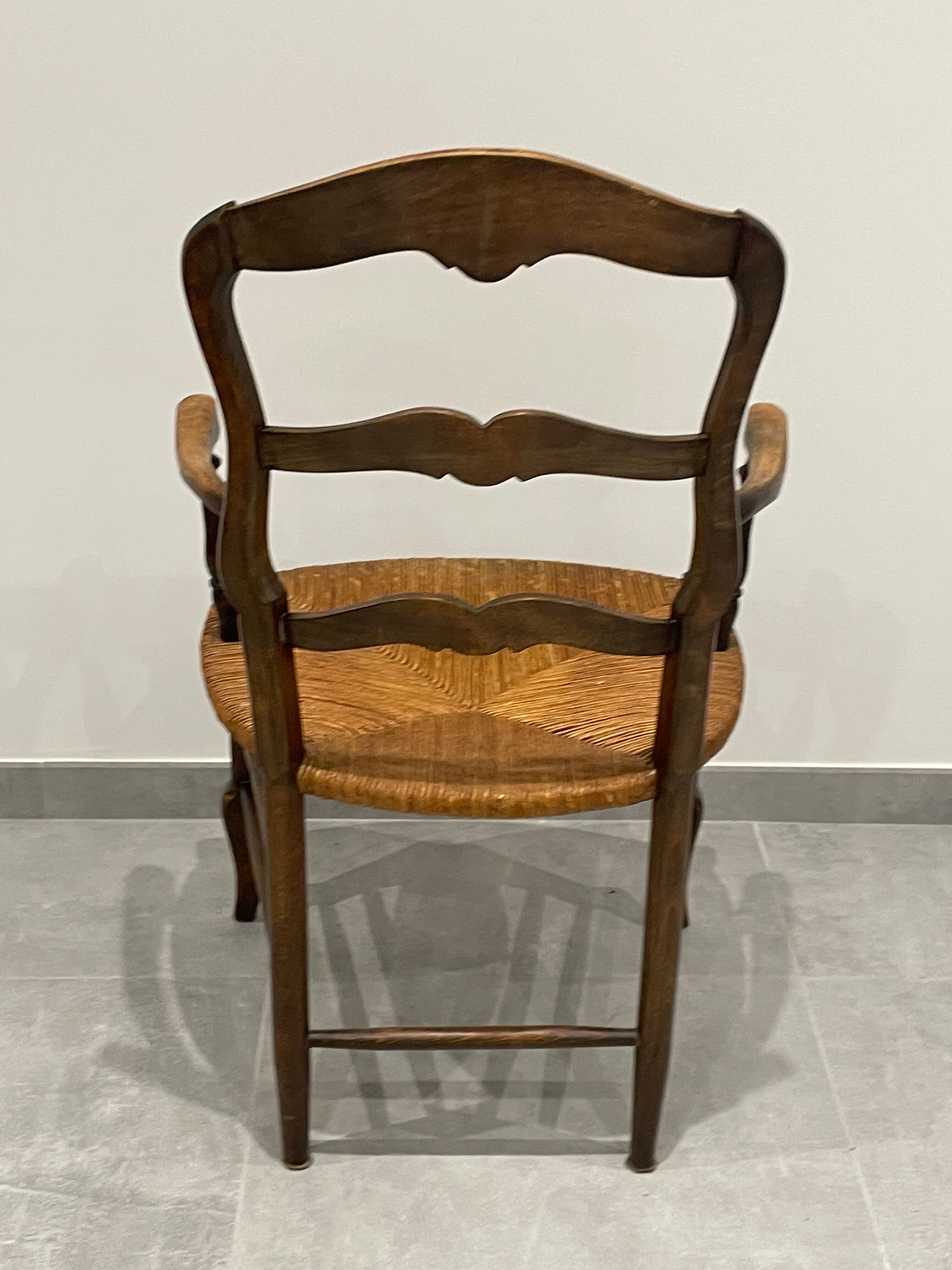 Provencal style straw armchair sometimes called marsh armchair