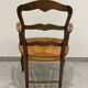Provencal style straw armchair sometimes called marsh armchair