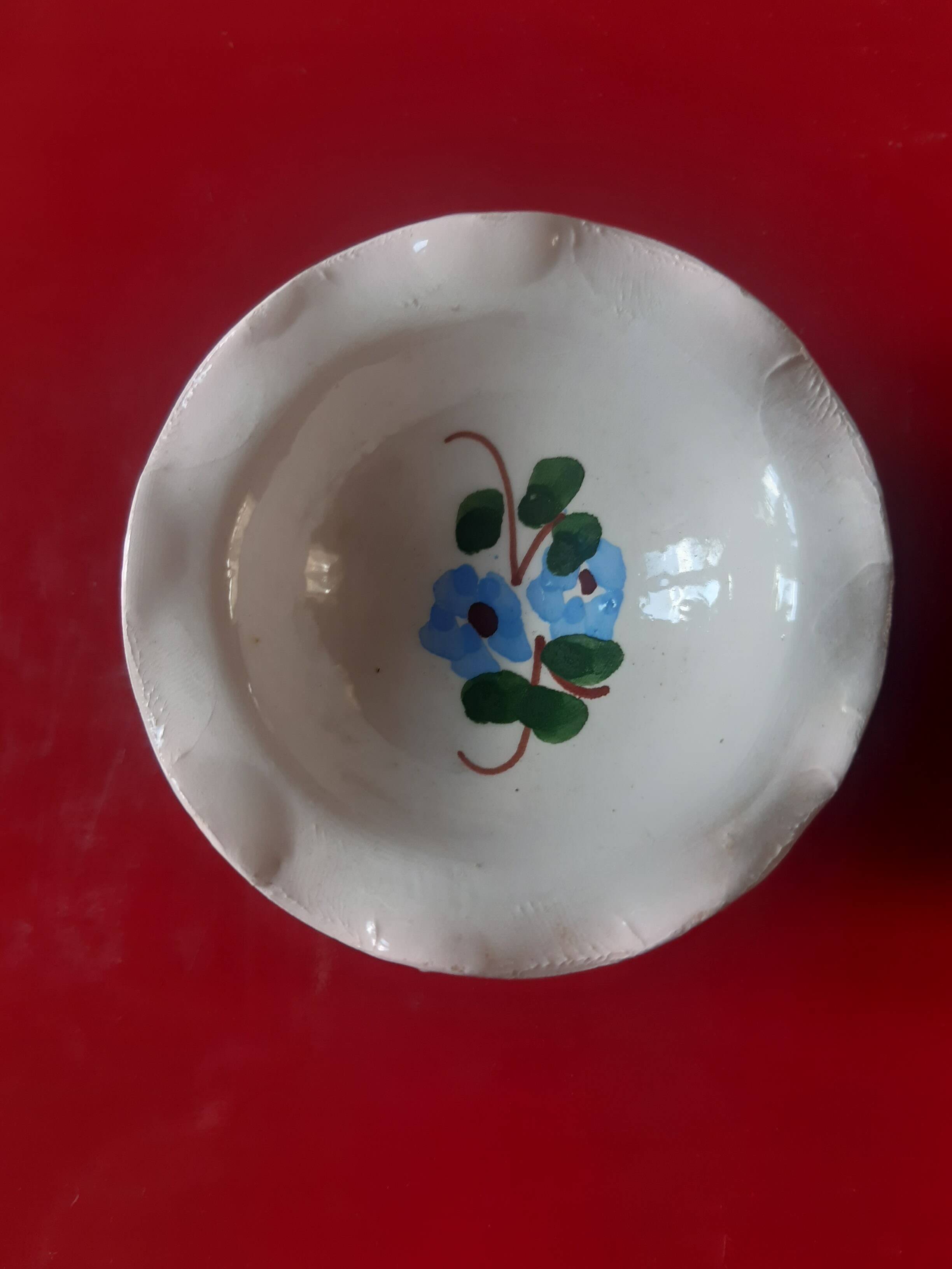 Coupelle vide poche en faïence décor fleuri bleu et vert.