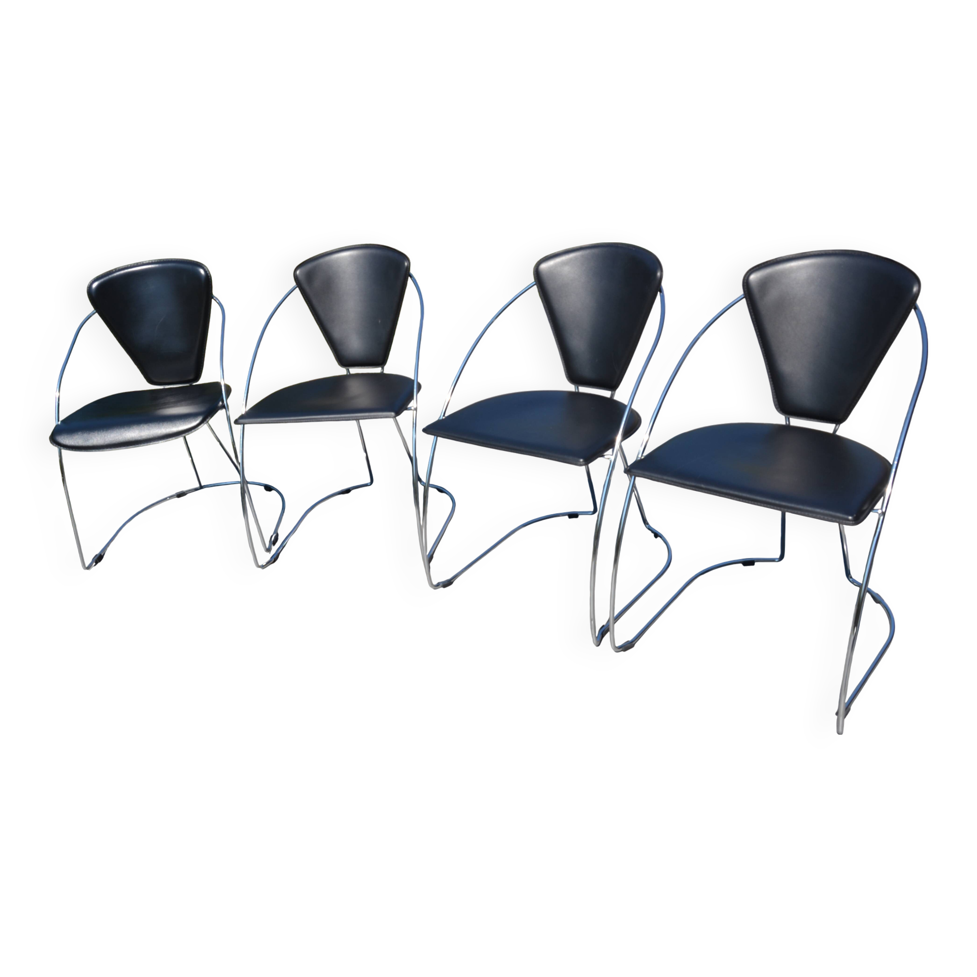 4 chrome and leather chairs designed by Italy